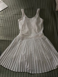 Chic white dress with pleated skirt